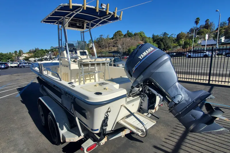 Slide: The Image of 2001 Sea Fox 215 Bay Fisher boat with Yamaha outboard motor on a trailer. - 3