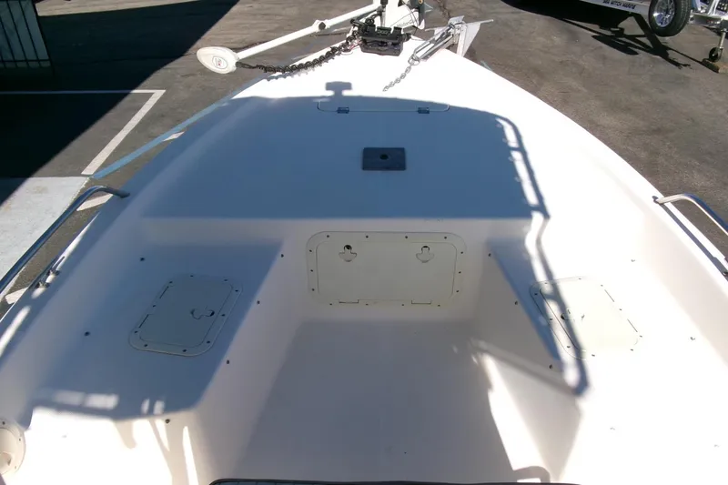 Slide: The Image of 2001 Sea Fox 215 Bay Fisher boat deck with storage compartments and anchor. - 8