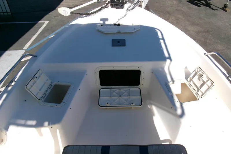 Slide: The Image of 2001 Sea Fox 215 Bay Fisher boat deck with open storage compartments. - 9