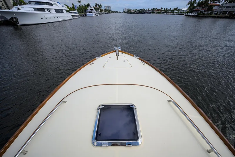Slide: The Image of Bow view of 2017 Hinckley Picnic Boat 37 MKIII on a calm waterway. - 11