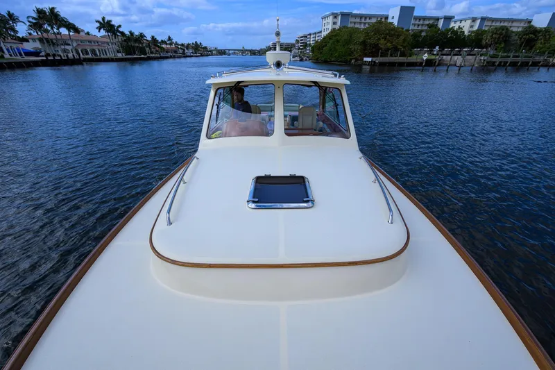Slide: The Image of 2017 Hinckley Picnic Boat 37 MKIII cruising on a scenic waterway. - 13