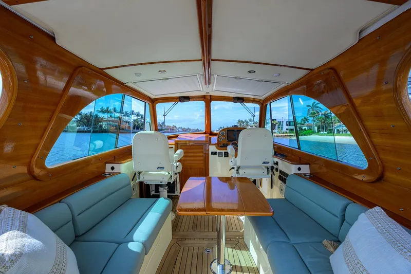 Slide: The Image of Interior of 2017 Hinckley Picnic Boat 37 MKIII with elegant wood finish and waterfront view. - 17
