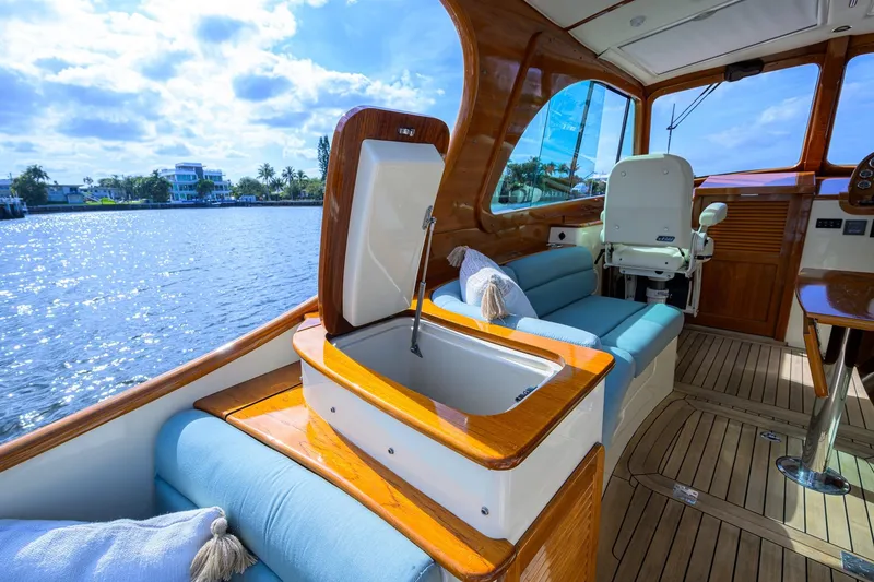 Slide: The Image of Luxurious 2017 Hinckley Picnic Boat 37 MKIII interior with elegant seating and scenic water view. - 18