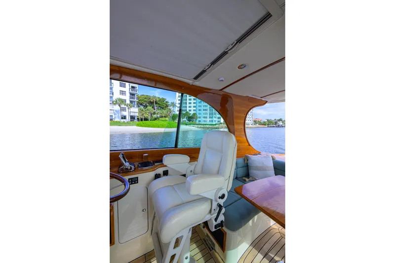 Slide: The Image of Interior of 2017 Hinckley Picnic Boat 37 MKIII with luxurious seating and waterfront view. - 22