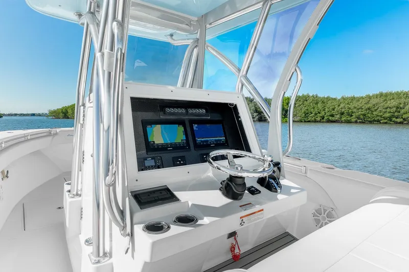 Slide: The Image of 2025 SeaHunter 31 Tournament boat cockpit with advanced navigation system on a sunny day. - 10