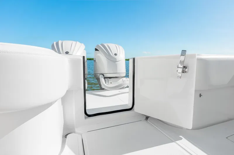 Slide: The Image of 2025 SeaHunter 31 Tournament boat with open deck view and twin engines. - 12