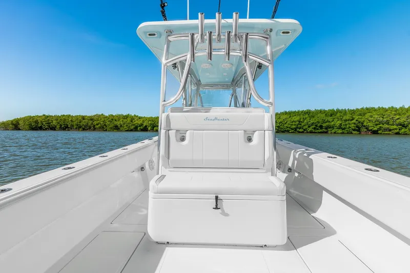 Slide: The Image of 2025 SeaHunter 31 Tournament boat interior with sleek design on calm water. - 13