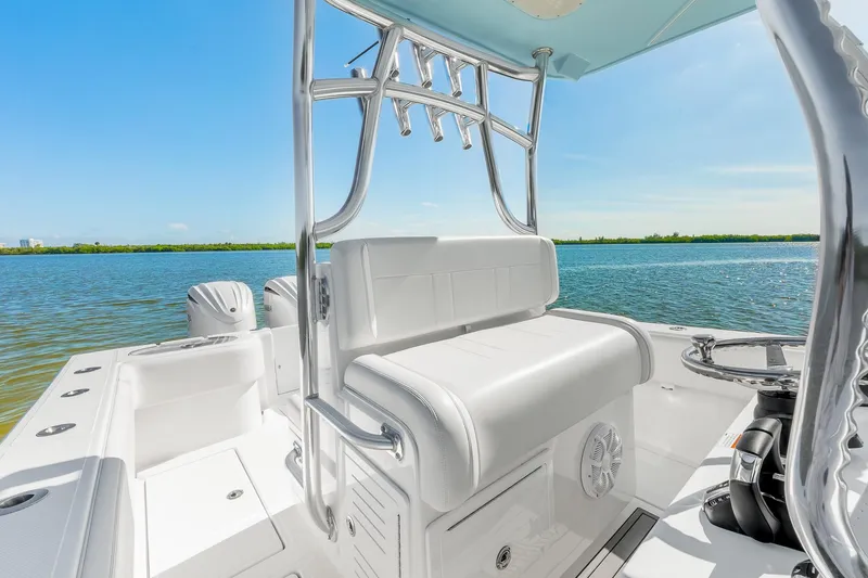 Slide: The Image of 2025 SeaHunter 31 Tournament boat interior with seating, ocean view, and clear blue sky. - 14