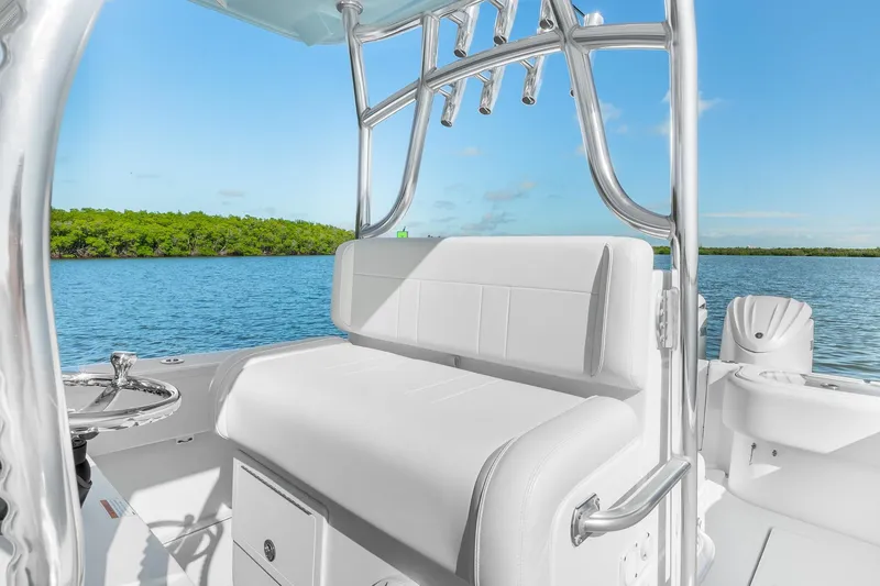 Slide: The Image of 2025 SeaHunter 31 Tournament boat interior with white seating, chrome details, and scenic water view. - 15