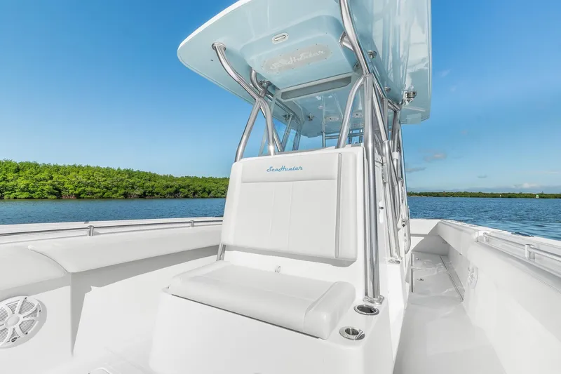 Slide: The Image of 2025 SeaHunter 31 Tournament boat on calm water, featuring sleek design and spacious seating. - 17