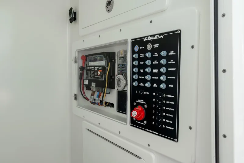 Slide: The Image of Control panel of 2025 SeaHunter 31 Tournament boat, featuring switches and wiring. - 19
