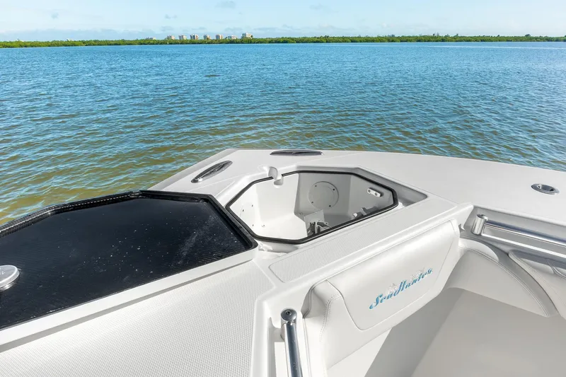 Slide: The Image of 2025 SeaHunter 31 Tournament boat on calm water, featuring sleek design and spacious deck. - 21