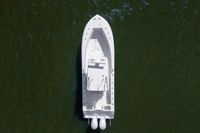 Slide: The Image of Aerial view of 2025 SeaHunter 31 Tournament boat on green water. - 6