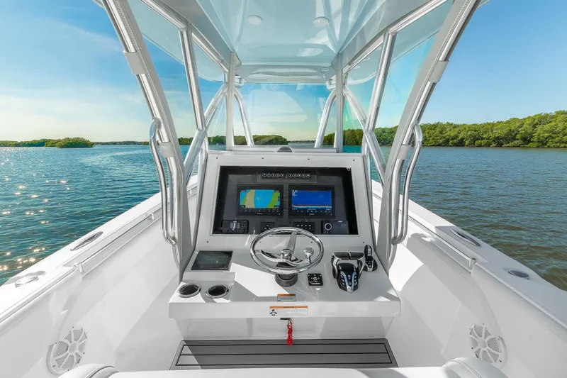 Slide: The Image of 2025 SeaHunter 31 Tournament boat cockpit with advanced navigation system on a sunny day. - 9