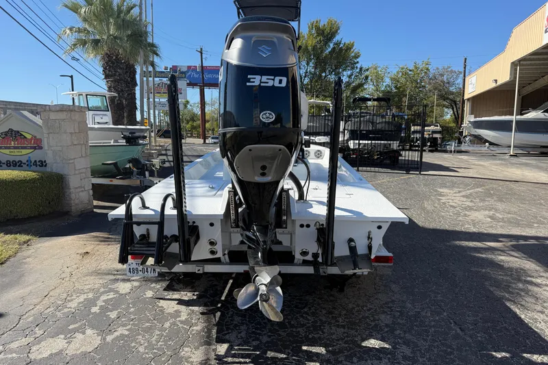 Slide: The Image of SCB R24 boat 2024 at dock, calm water, blue sky. - 1