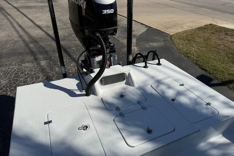 Slide: The Image of 2024 SCB R24 boat on trailer in outdoor dealership lot. - 11