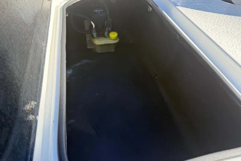 Slide: The Image of 2024 SCB R24 boat on trailer, featuring sleek design and powerful engine. - 13