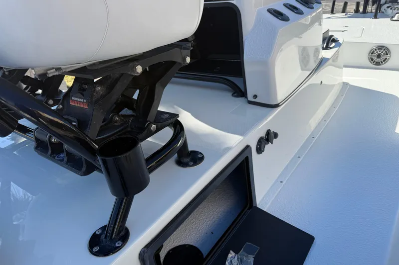 Slide: The Image of Open storage compartment on 2024 SCB R24 boat deck. - 21