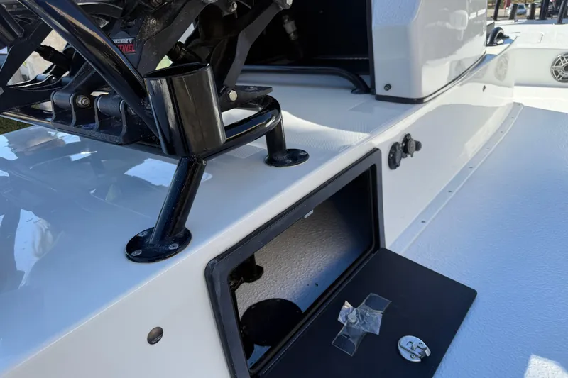 Slide: The Image of Open hatch on 2024 SCB R24 boat, revealing interior compartment. - 22