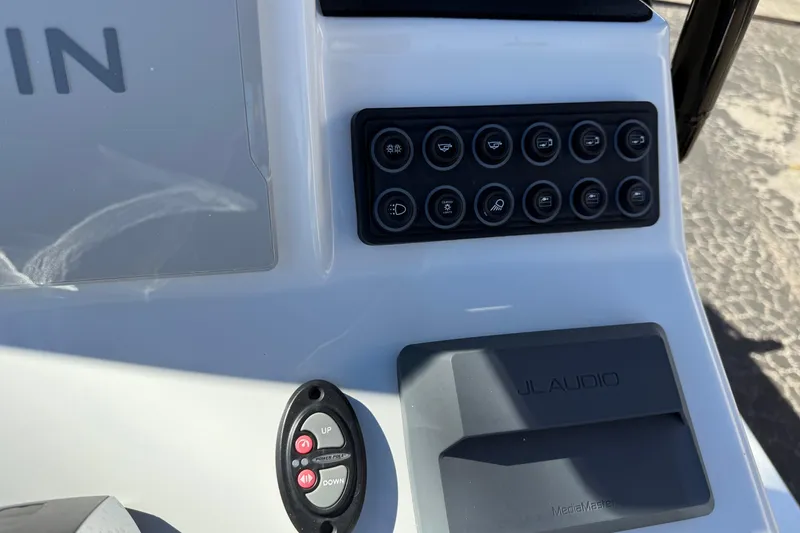 Slide: The Image of 2024 SCB R24 boat livewell with rod holders and open lid. - 26