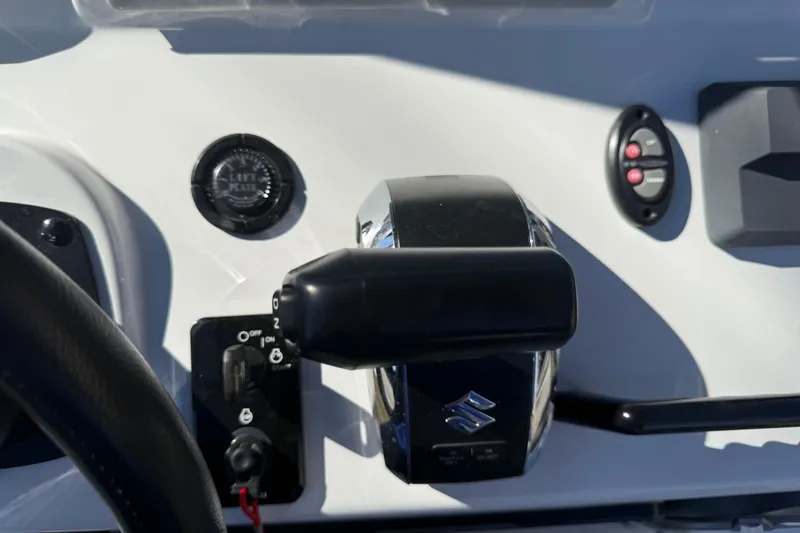 Slide: The Image of 2024 SCB R24 boat dashboard with Garmin navigation and Suzuki controls. - 29