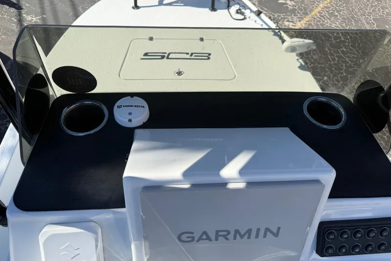 Slide: The Image of 2024 SCB R24 boat compartment with secured hoses and storage hatch. - 31