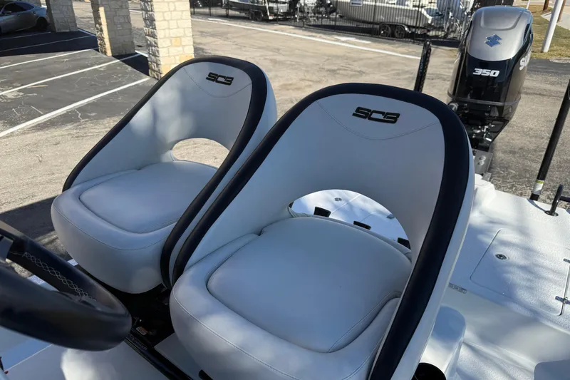 Slide: The Image of Control panel of 2024 SCB R24 boat featuring JL Audio system and button interface. - 32