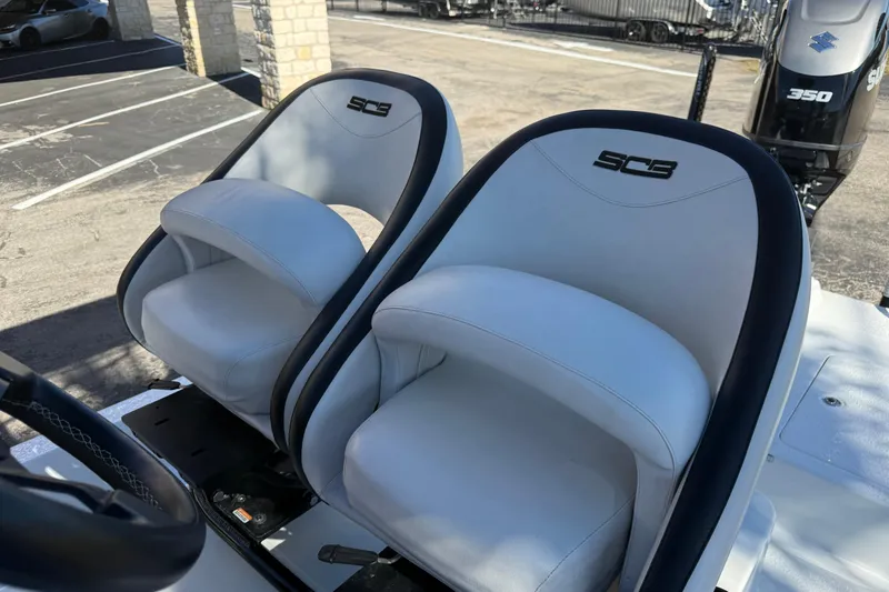 Slide: The Image of 2024 SCB R24 boat dashboard featuring Garmin and Suzuki components. - 33