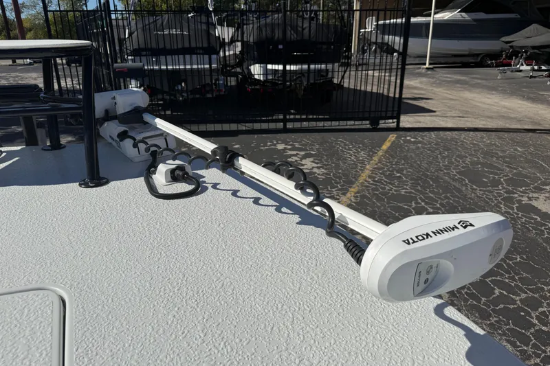 Slide: The Image of 2024 SCB R24 boat storage compartment with latch, black and white design. - 42