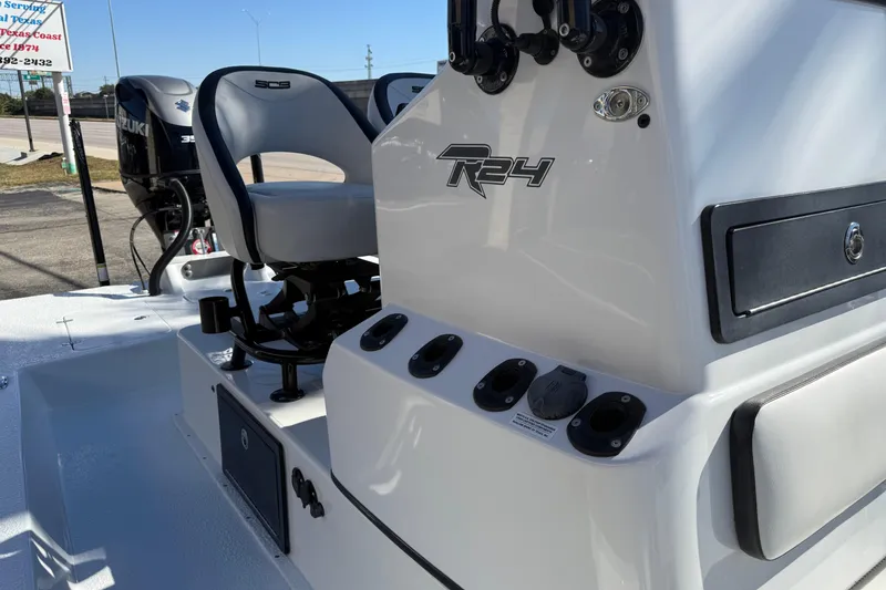 Slide: The Image of 2024 SCB R24 boat storage compartment with open lid, showcasing interior design and functionality. - 43