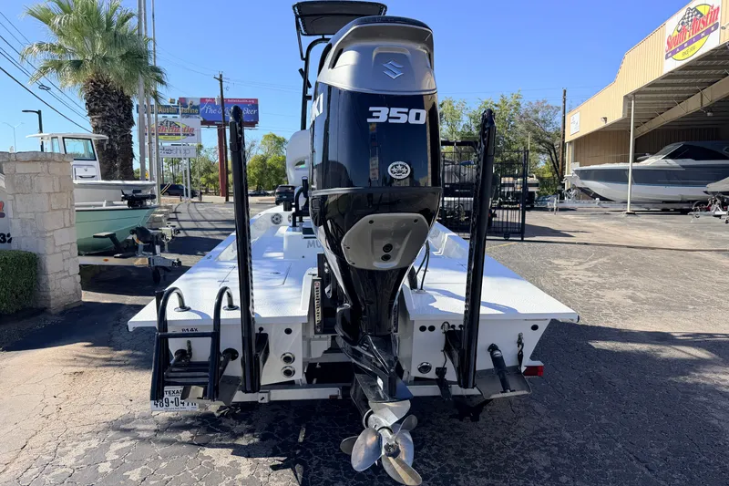 Slide: The Image of 2024 SCB R24 boat with Suzuki 350 engine at a dealership. - 55