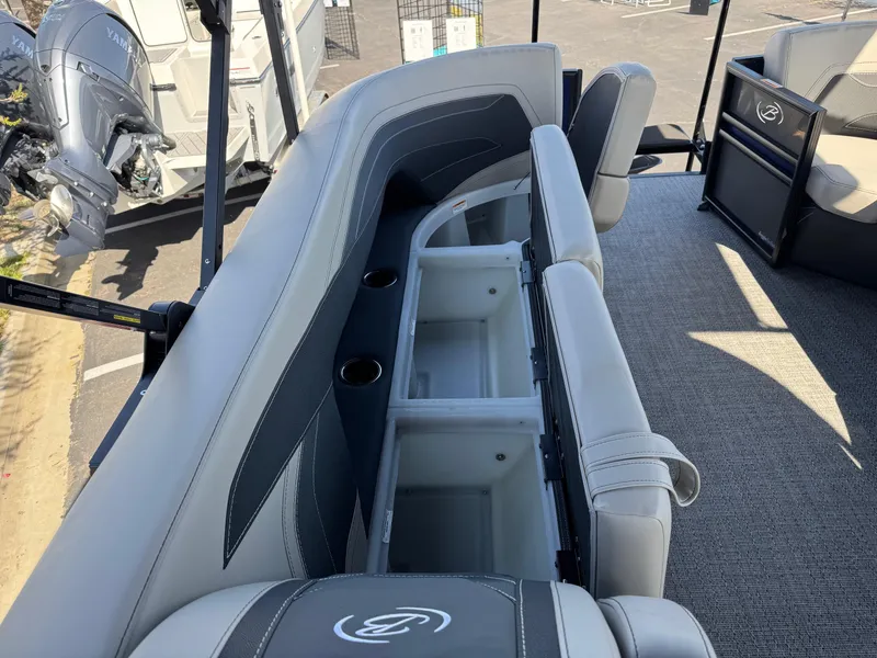 Slide: The Image of 2026 Barletta Cabrio 24U boat interior with open storage compartments and seating. - 17