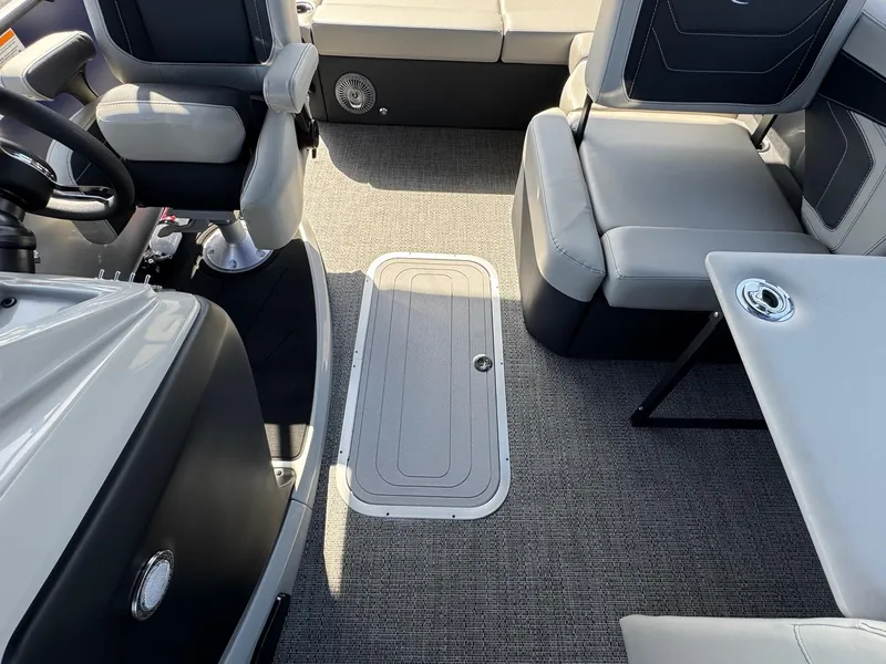 Slide: The Image of 2026 Barletta Cabrio 24U interior with gray seating and carpeted flooring. - 22