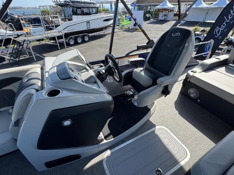 Slide: The Image of 2026 Barletta Cabrio 24U boat interior with captain's chair and control panel. - 27