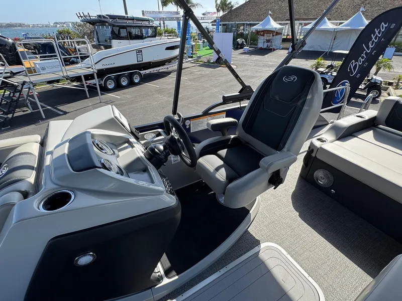 Slide: The Image of 2026 Barletta Cabrio 24U boat interior with steering wheel and seating. - 28