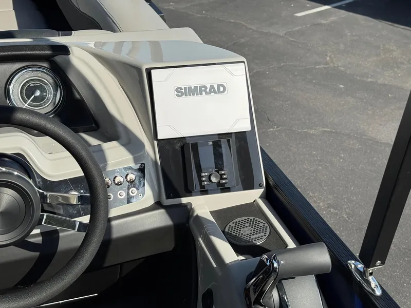 Slide: The Image of 2026 Barletta Cabrio 24U dashboard featuring Simrad navigation system and steering wheel. - 30