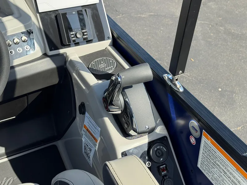 Slide: The Image of Control panel of 2026 Barletta Cabrio 24U boat with throttle and audio system. - 31