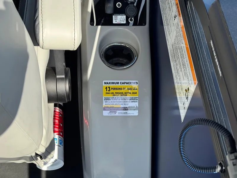 Slide: The Image of Barletta Cabrio 24U 2026 boat capacity label, seating, and safety instructions. - 32