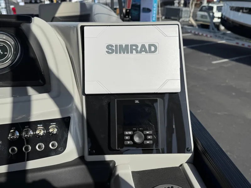 Slide: The Image of Control panel of 2026 Barletta Cabrio 24U with Simrad and JBL systems. - 35
