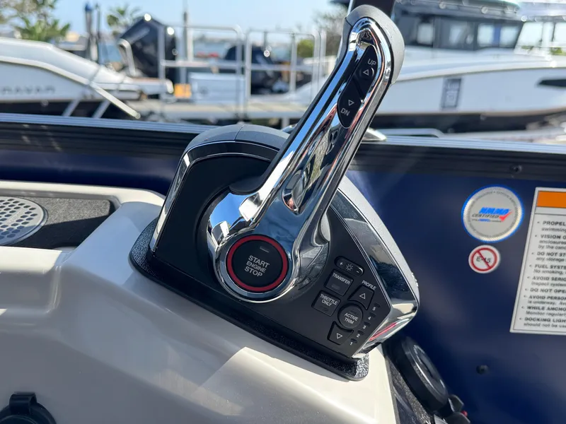 Slide: The Image of Control panel of 2026 Barletta Cabrio 24U boat with start/stop button and throttle lever. - 36