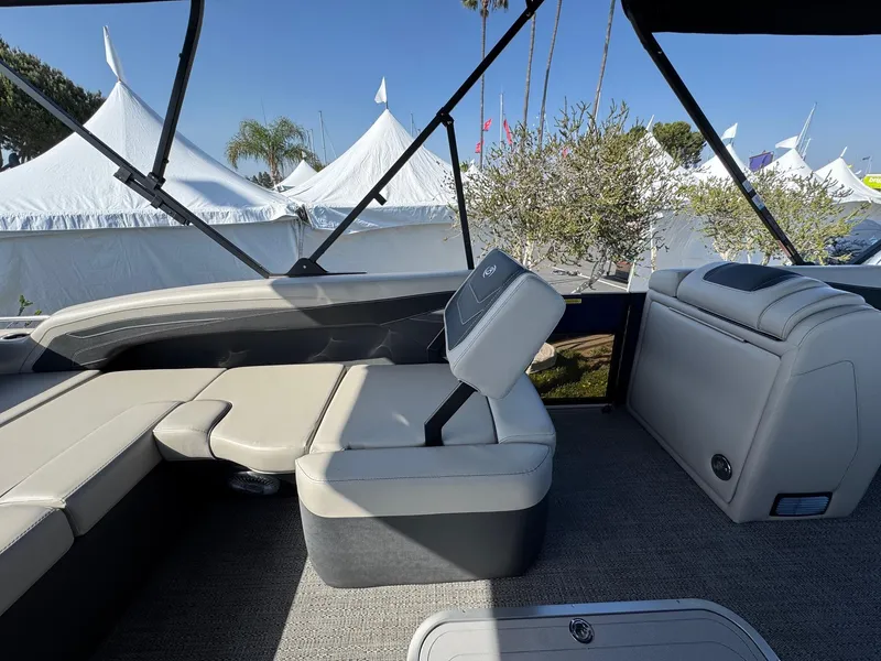Slide: The Image of 2026 Barletta Cabrio 24U boat interior with luxurious seating and canopy. - 37