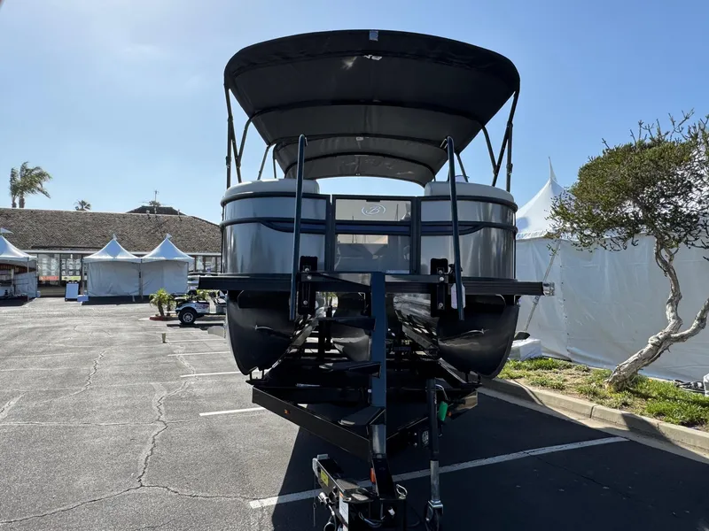 Slide: The Image of 2026 Barletta Cabrio 24U pontoon boat on trailer in sunny outdoor setting. - 4