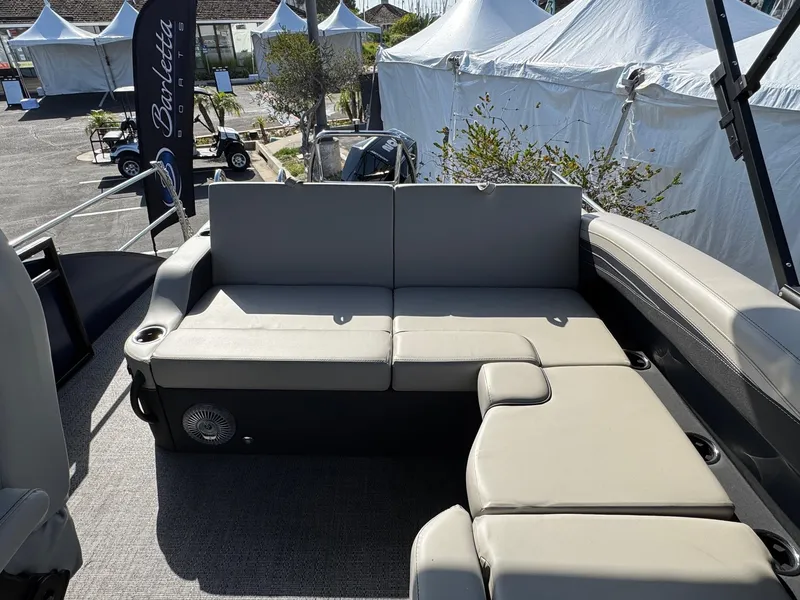 Slide: The Image of Luxurious seating on 2026 Barletta Cabrio 24U pontoon boat at outdoor event. - 45