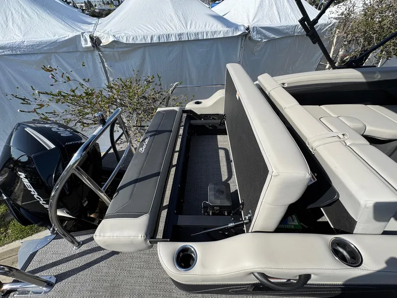 Slide: The Image of 2026 Barletta Cabrio 24U boat interior with seating and Mercury engine. - 46