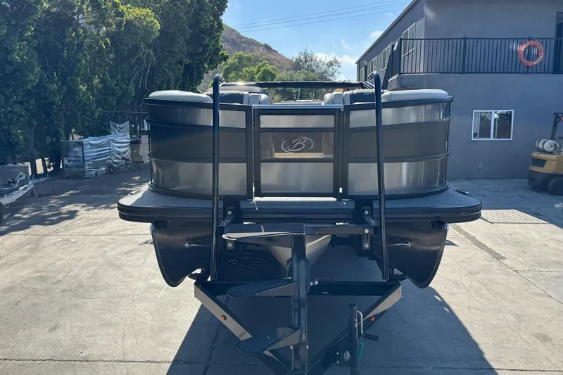 Slide: The Image of 2026 Barletta Lusso 23UC pontoon boat parked outdoors, rear view. - 121