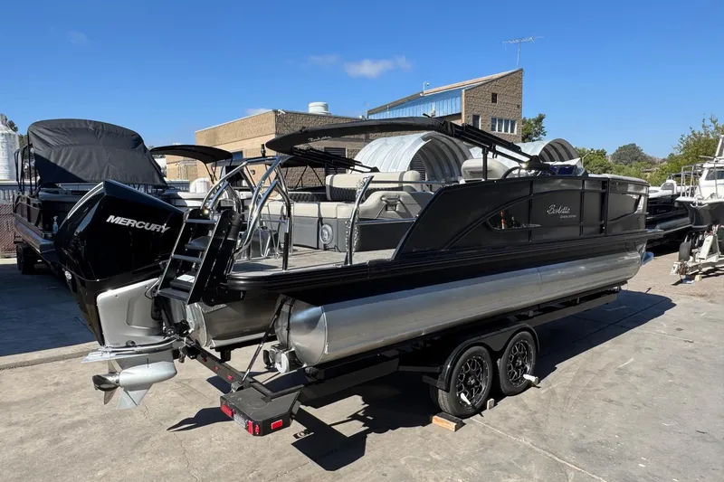 Slide: The Image of 2026 Barletta Lusso 23UC pontoon boat with Mercury engine on trailer. - 128