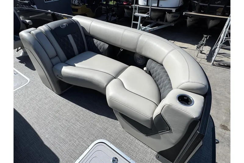 Slide: The Image of Luxurious seating on 2026 Barletta Lusso 23UC pontoon boat, featuring elegant upholstery and cup holder. - 132