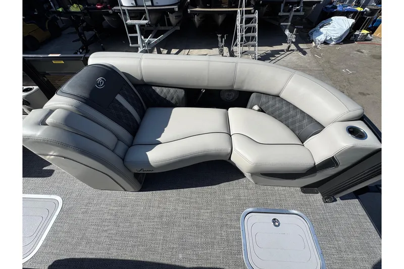Slide: The Image of Luxurious seating on 2026 Barletta Lusso 23UC pontoon boat, featuring elegant upholstery and cup holder. - 133