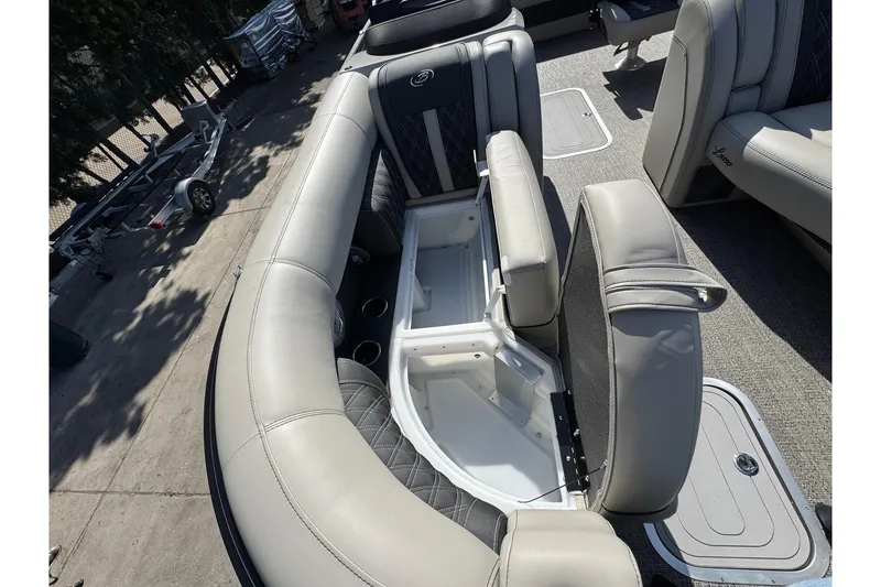 Slide: The Image of 2026 Barletta Lusso 23UC pontoon boat interior with open storage compartment. - 140
