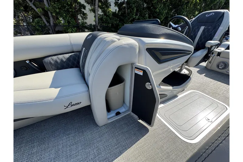 Slide: The Image of 2026 Barletta Lusso 23UC boat interior with luxurious seating and storage compartment. - 142